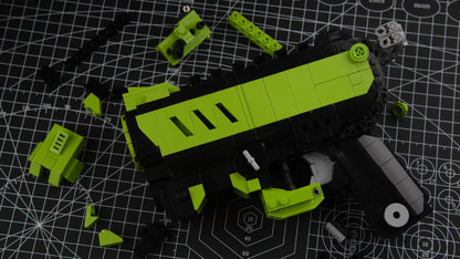 green phantom block gun blaster with scattered block parts on table